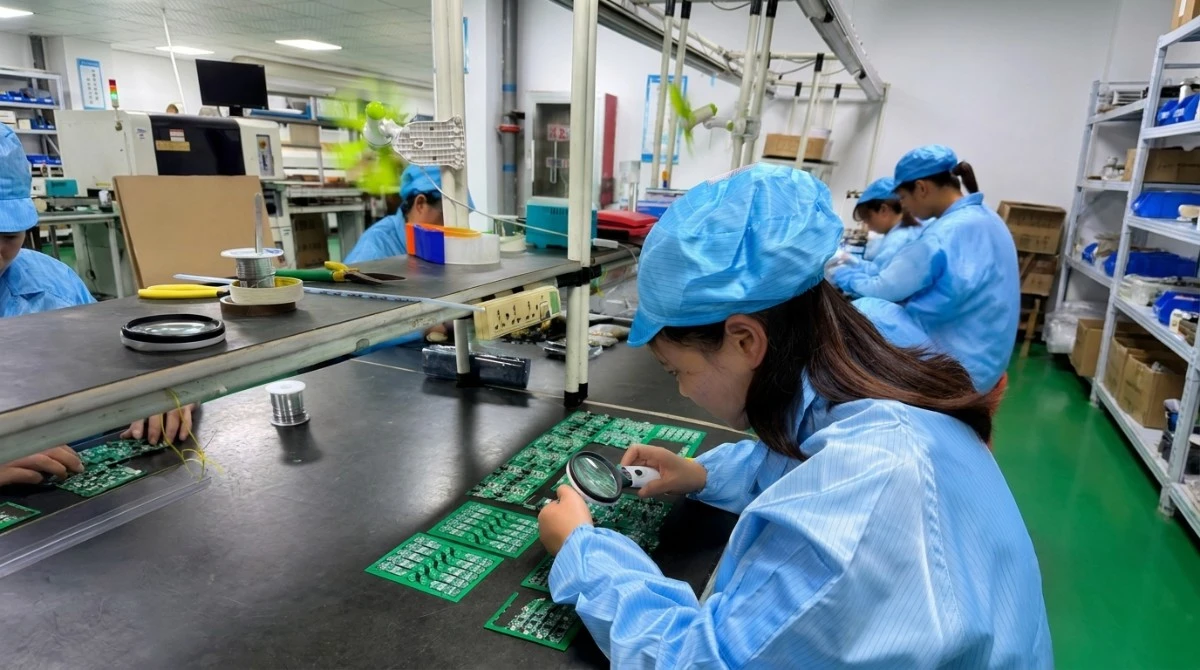 Quality control check of wireless tour guide transmitters and receivers on a factory production line Quality control check of wireless tour guide transmitters and receivers on a factory production line